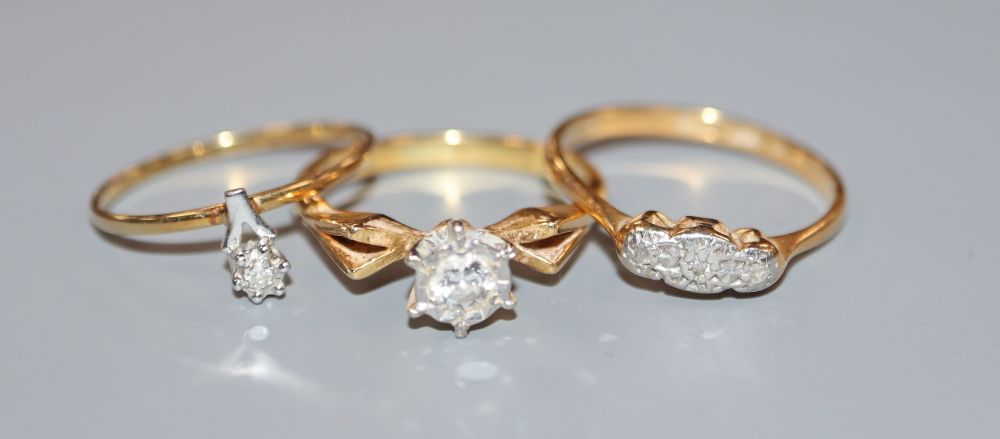 Two 18ct and diamond set dress rings including 1970s, gross 5.3 grams and a 585 and diamond ring, gross 0.8 grams.